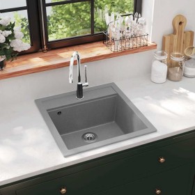 Fregadero de cocina de granito con un seno gris