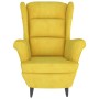 Sillón orejero con taburete terciopelo amarillo mostaza