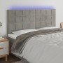 Cabecero con luces LED terciopelo gris claro 160x5x118/128 cm en Cabeceros y pies de cama | Comprar online en Foro24