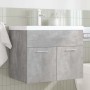 Mueble de baño con lavabo incorporado y grifo gris hormigón