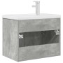 Mueble de baño con lavabo incorporado y grifo gris hormigón