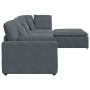 Sofá modular con reposapiés y cojines en terciopelo gris oscuro
