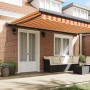 Toldo retráctil aluminio y tela amarillo y blanco 4,5x3 m
