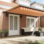 Toldo retráctil aluminio y tela amarillo y blanco 5x3 m