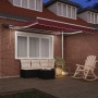 Toldo retráctil manual con luces LED burdeos 300x250 cm