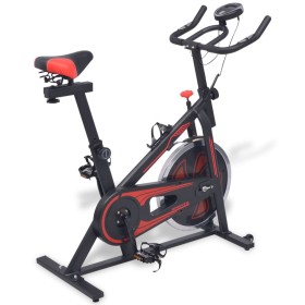 Bicicleta estática con sensores de pulso negra y roja