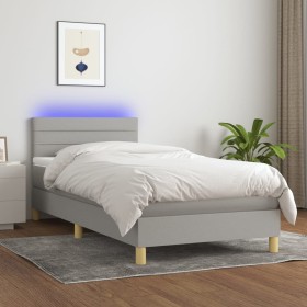 Cama box spring con colchón tela y LED gris claro 90x190 cm