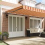 Toldo Retráctil amarillo y naranja 600 x 300 cm tela