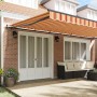 Toldo Retráctil amarillo y naranja 600 x 350 cm tela