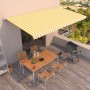 Toldo retráctil automático amarillo y blanco 600x350 cm
