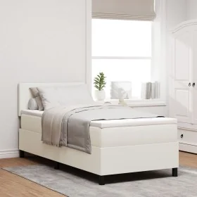 Cama con base de resortes con colchón crema
