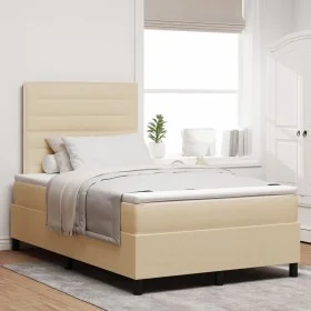 Cama con base de resortes con colchón crema