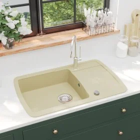 Fregadero de cocina de granito con un seno beige